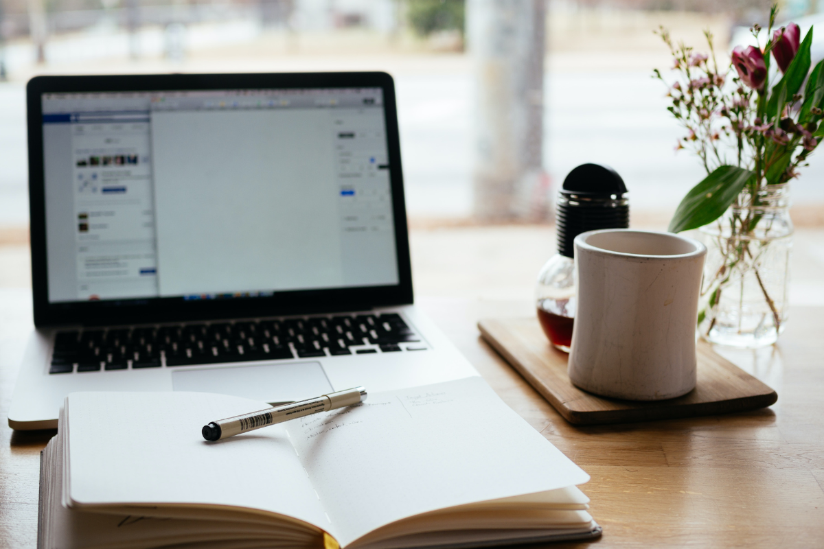 A laptop is open reading our blog on accessible events and venues